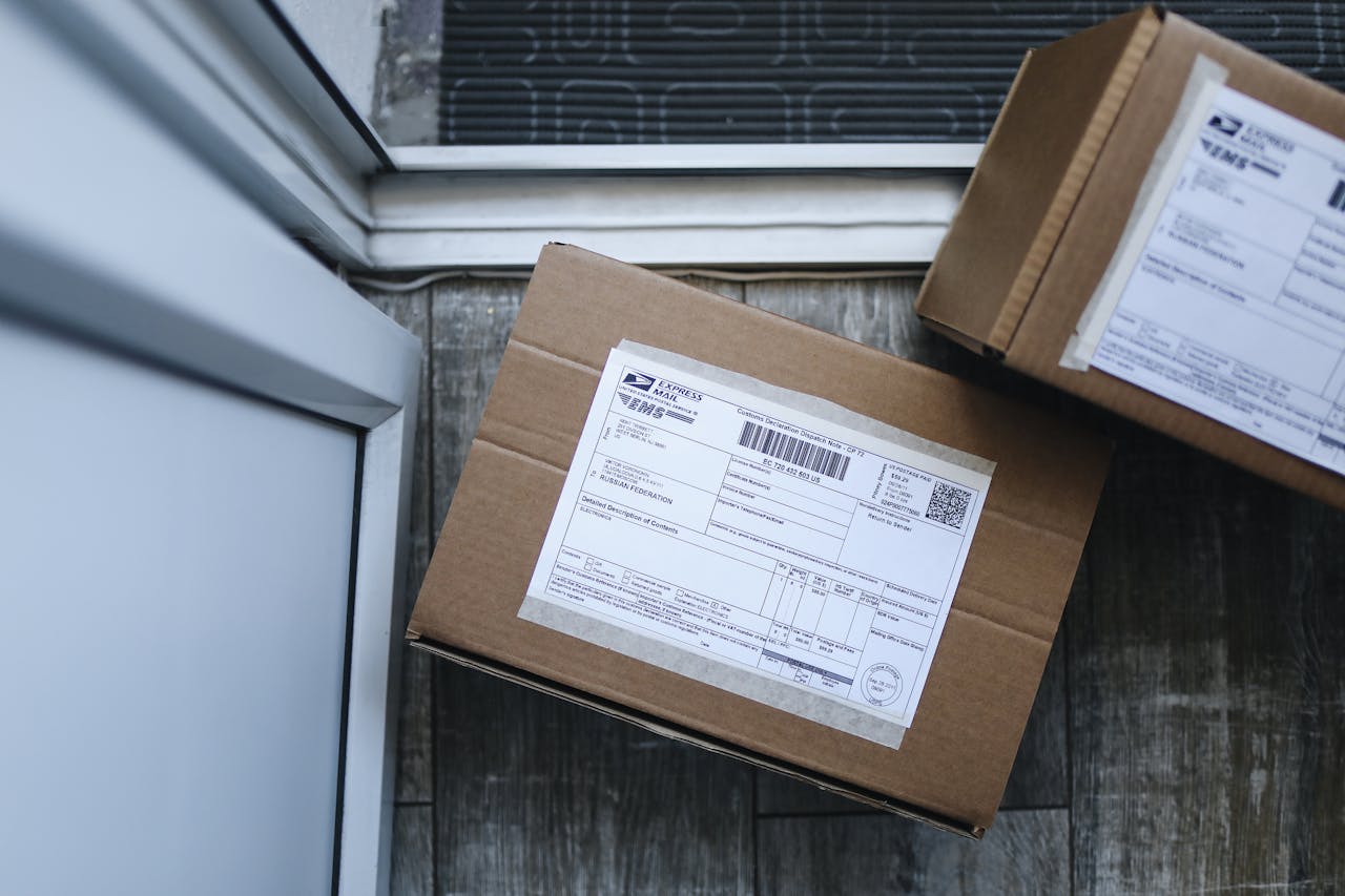 our-experience Close-up of a package delivery box on a doorstep, highlighting logistics concepts.